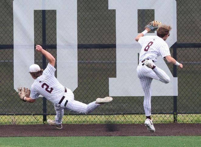 bruce bishop  chronicle new albanys quinn blaney drops the ball after colliding with van routhier while trying to grab a first-inning drive by amhersts landon wolf that ended up an inside-the-park homer during the division ii state semifinal friday june 13 2025 in canton